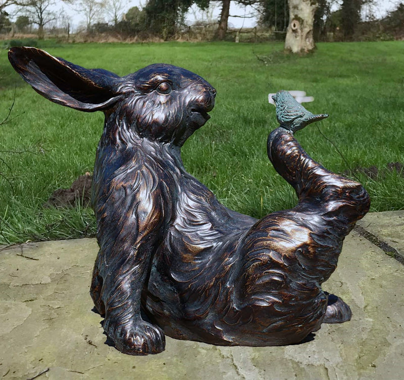 Bronze effect Rabbit with a Bird on his Foot figurine, quirky home or garden decoration